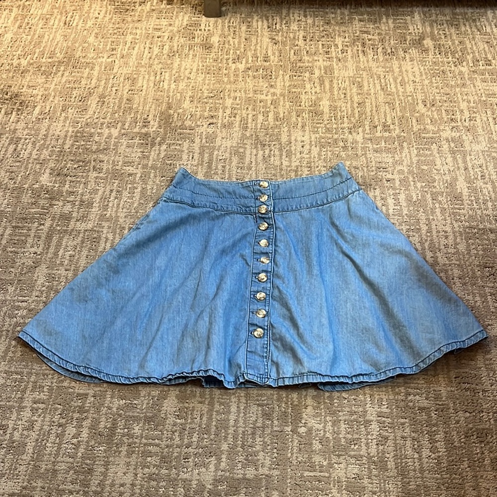 Flared denim skirt with side pockets